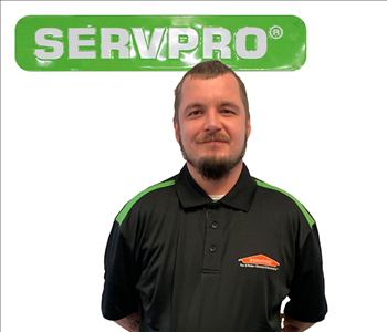 Dylan Joiner, SERVPRO green sign behind his cutout picture, white background